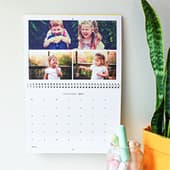 Wall calendar with family photos and monthly dates displayed