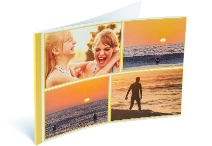 Softcover photo book with a collage of beach sunset images on the cover.